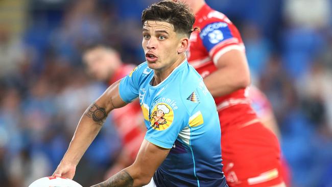 Jayden Campbell of the Titans passes during the round six NRL match between Gold Coast Titans and St George Illawarra Dragons at Cbus Super Stadium on April 09, 2023 in Gold Coast, Australia. (Photo by Chris Hyde/Getty Images)