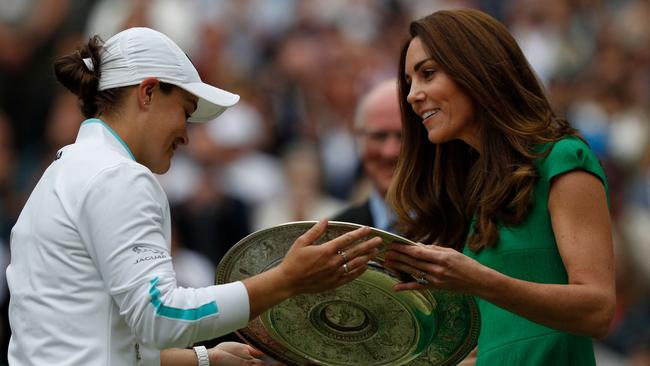 Ash Barty receives the dish from the Duchess of Cambridge. Picture: AFP