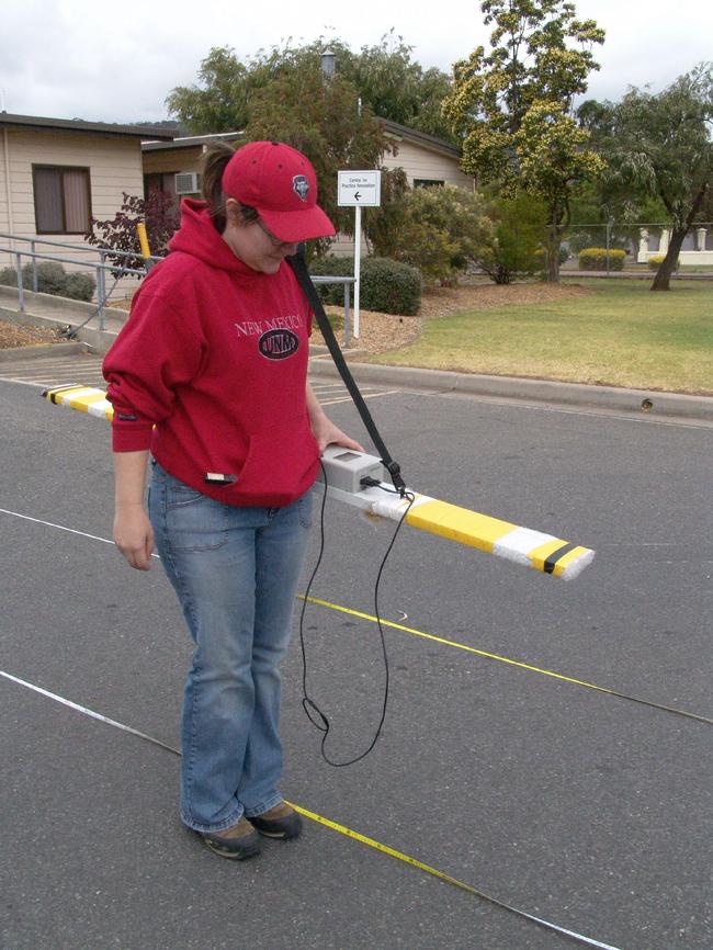 Flinders University archeology graduate Alice Beale surveys the Repatriation Hospital carpark in 2007, looking for evidence of the shelters.