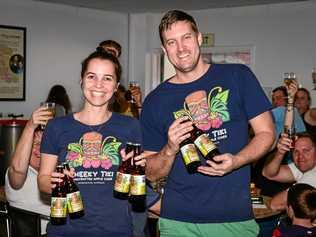 NEW BREW: Zoe Young and Josh Phillips show off the Cheeky Tiki Pineapple and Coconut Cider. Picture: Brian Cassidy