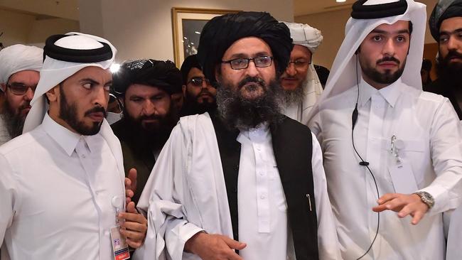 February 29, 2020: Taliban co-founder Mullah Abdul Ghani Baradar (C) leaves after signing an agreement with the United States during a ceremony in the Qatari capital Doha. Picture: Giuseppe Cacace