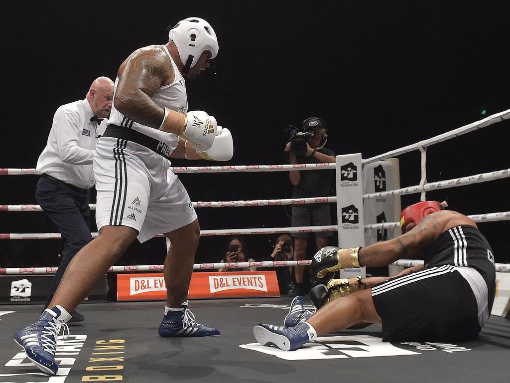 Paulo drops Neville Costigan during their bout in the All Stars Rugby League Rivals fight night in the pre-season. Picture: Matt Taylor