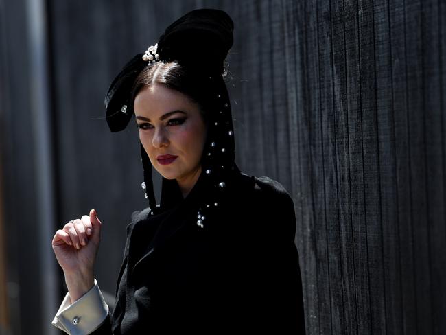 A woman in traditional black and white at the Birdcage on Victoria Derby Day. Picture: Tracey Nearmy, AAP Image.