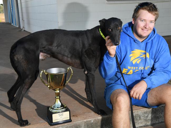 Darwin Greyhound Association premiership-winning trainer Steele Bolton with Rev Fred Sloy. Picture: Katrina Bridgeford