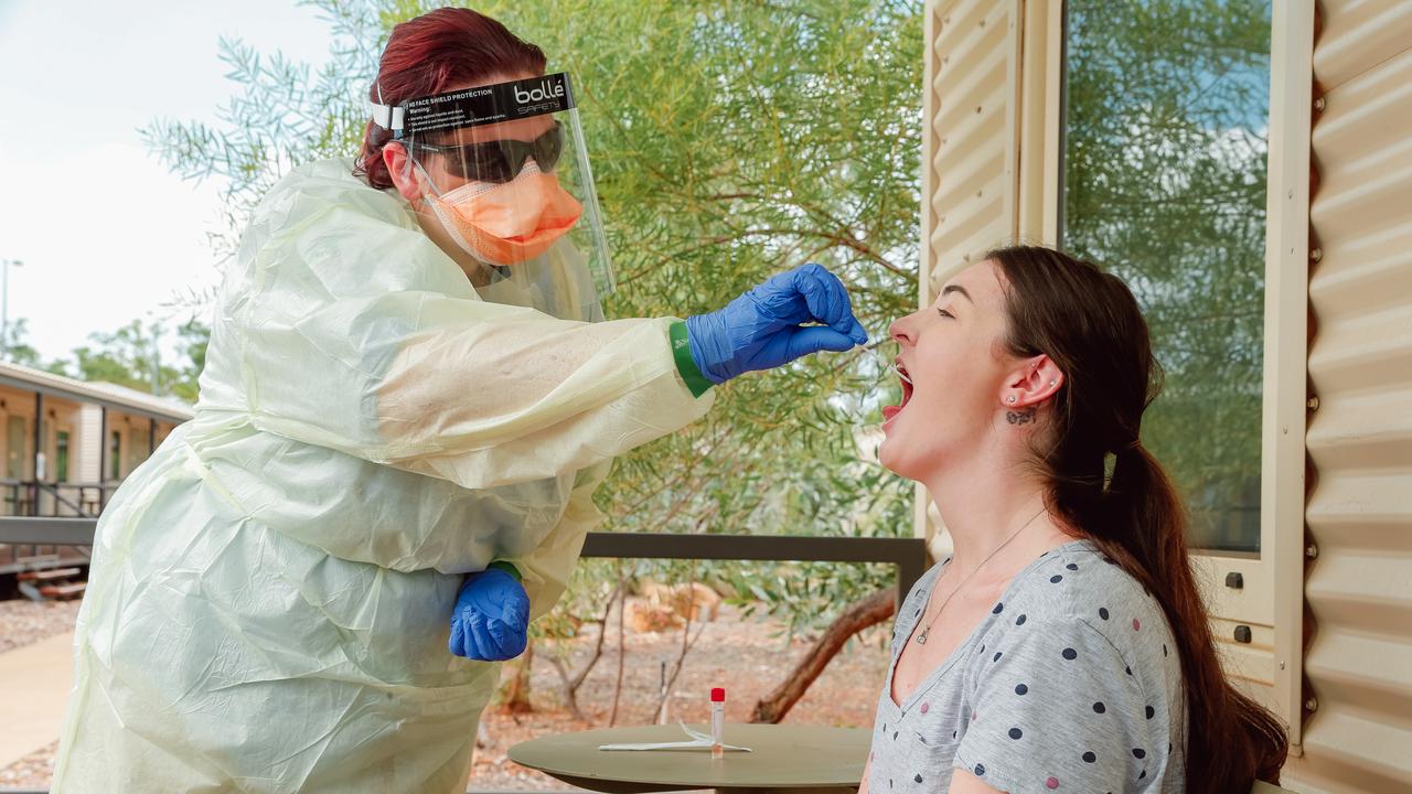 A report into the mental health impacts of quarantine at Howard Springs has been released. Picture, a health worker tests a Howard Springs volunteer for Covid during the height of the pandemic. Picture: GLENN CAMPBELL