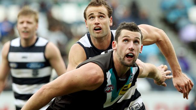 Port Adelaide’s Brent Renouf rucks against Geelong’s Trent West.