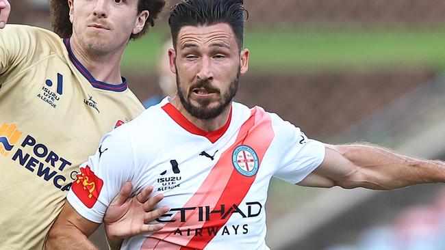 NEWCASTLE, AUSTRALIA - DECEMBER 03: Mark Natta of the Jets and Mathew Leckie of Melbourne City challenge for the ball during the A-League Men round six match between Newcastle Jets and Melbourne City at McDonald Jones Stadium, on December 03, 2023, in Newcastle, Australia. (Photo by Jeremy Ng/Getty Images)