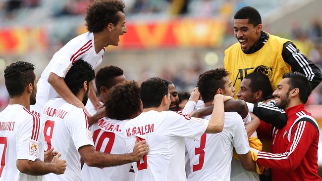 CANBERRA, AUSTRALIA - JANUARY 11: United Arab Emirates players celebrate a goal during the 2015 Asian Cup match between the United Arab Emirates and Qatar at Canberra Stadium on January 11, 2015 in Canberra, Australia. (Photo by Stefan Postles/Getty Images)