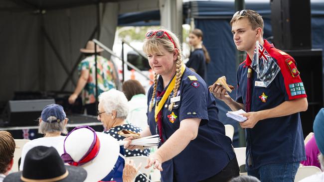 Drayton Scout Group leaders Taylor Titcume and Riley Kuhnemann hand out flags to the audience at the Toowoomba Australia Day celebrations at Picnic Point, Sunday, January 26, 2025. Picture: Kevin Farmer