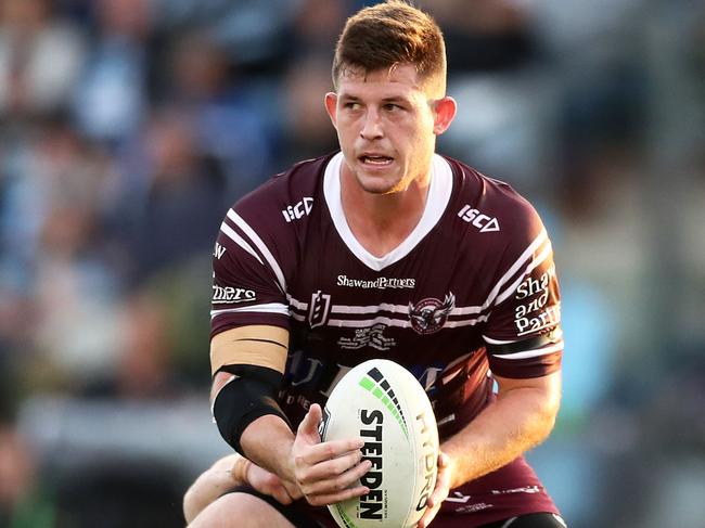 SYDNEY, AUSTRALIA - MAY 19: Cade Cust of the Sea Eagles is tackled by Paul Gallen of the Sharks during the round 10 NRL match between the Cronulla Sharks and the Manly Sea Eagles at Shark Park on May 19, 2019 in Sydney, Australia. (Photo by Matt King/Getty Images)