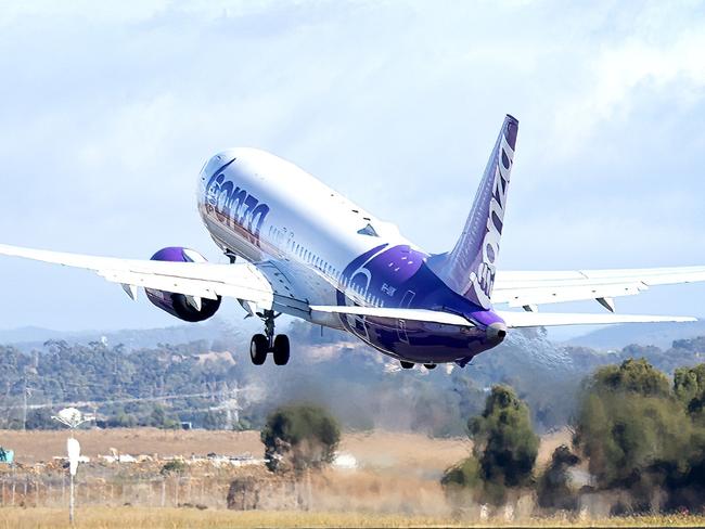 Bazza, Bonza's plane, getting wheels up from Melbourne Airport.