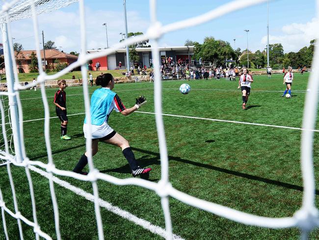 Kids play soccer after the official opening of the synthetic turf at Cammeray Park for the Northern Spirit football Gala day. Picture: Braden Fastier.