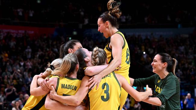 Australian players celebrate after winning bronze at the 2022 Women's Basketball World Cup.. (Photo by William WEST / AFP)