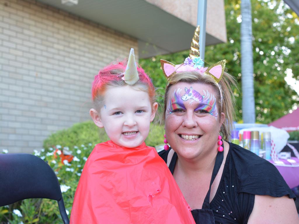 Chloe, 4, gets her face painted by Michelle from Unicorn Beauty Boutique at the 2017 Gatton Christmas Carnival.