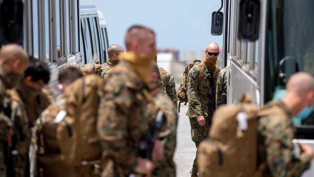 <s1>The Darwin-bound US Marines arrive at Kadena Air Base in Japan. Picture: Harrison Rakhshani</s1>