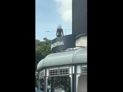 Man on roof at Cairns Central Shopping centre