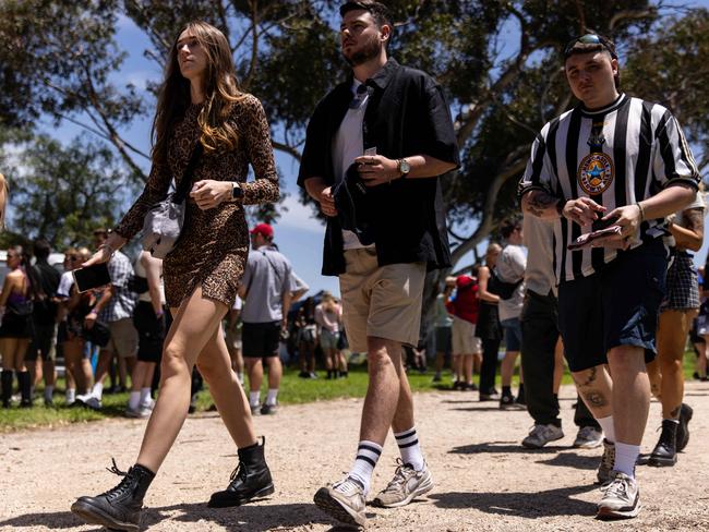 Many chose sneakers as their footwear of choice, preparing to dance into the night. Picture: NCA NewsWire / Diego Fedele,