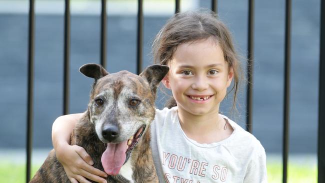 Taking care of Brodie is Ava Bowers,6, of Darra. Picture: AAP/Ric Frearson