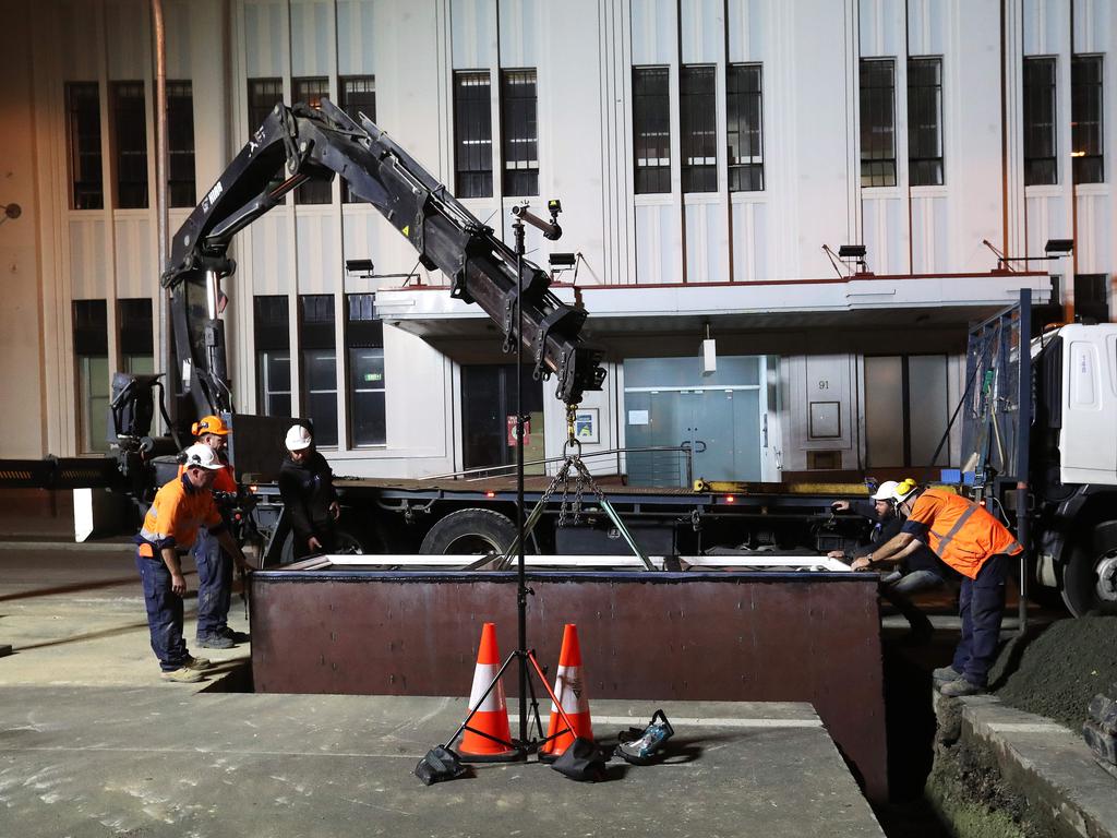 Work in Macquarie Street Hobart on the hole that will house the chamber performance artist Mike Parr will live in for 72 hours during Dark MOFO. Picture: NIKKI DAVIS-JONES