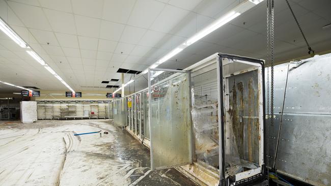 Total destruction: Coles Lismore after the flood and what remains of the supermarket's devastated interior. Picture: Renae Droop/RDW Photography