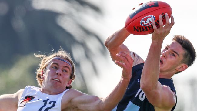 Vic Metro’s Ben De Bolfo takes a strong mark over Vic Country’s Noah Gadsby. Picture: Michael Klein