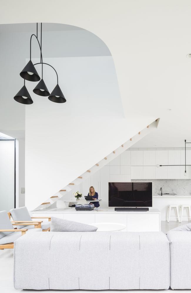 A curved ceiling in this space designed by Carter Williamson Architects draws the eye upward and makes the space feel bigger. Picture: Brett Boardman