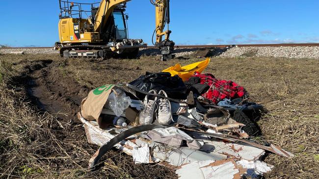 Crews repairing the damaged railway line the morning after a triple fatal crash involving a bus and car towing a caravan along the Bruce Highway in Gumlu on Sunday. Picture: Leighton Smith