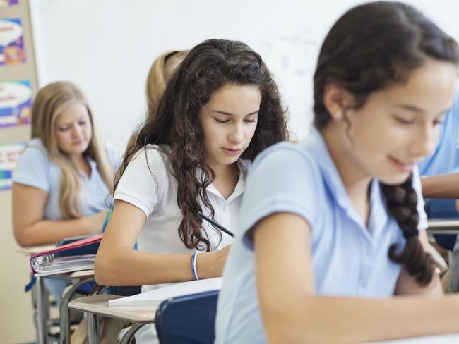 istock. Students sitting exam.