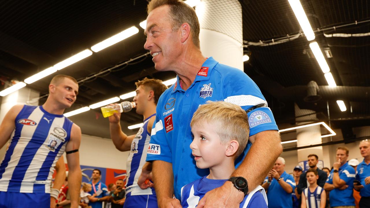 Alastair Clarkson celebrates with a young fan. Picture: Michael Willson/AFL Photos via Getty Images