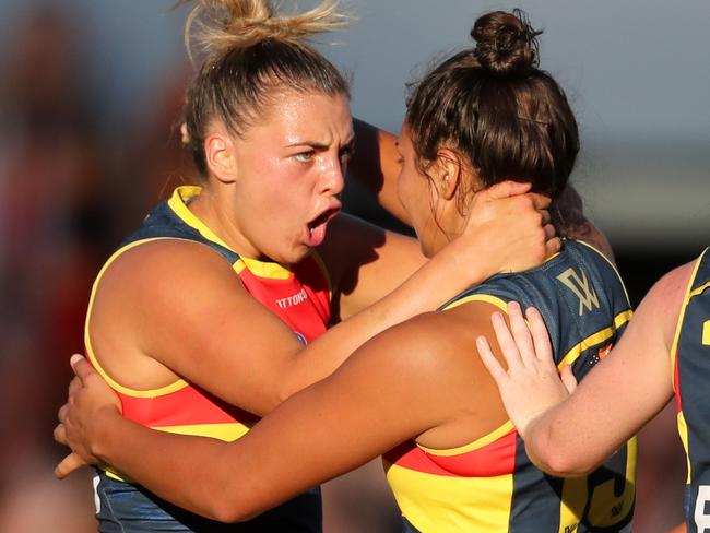 ADELAIDE, AUSTRALIA - FEBRUARY 3: Ruth Wallace of the Crows celebrates a goal with team mate Ebony Marinoff during the 2018 AFLW Round 01 match between the Adelaide Crows and the Brisbane Lions at Norwood Oval on February 3, 2018 in Adelaide, Australia. (Photo by AFL Media)