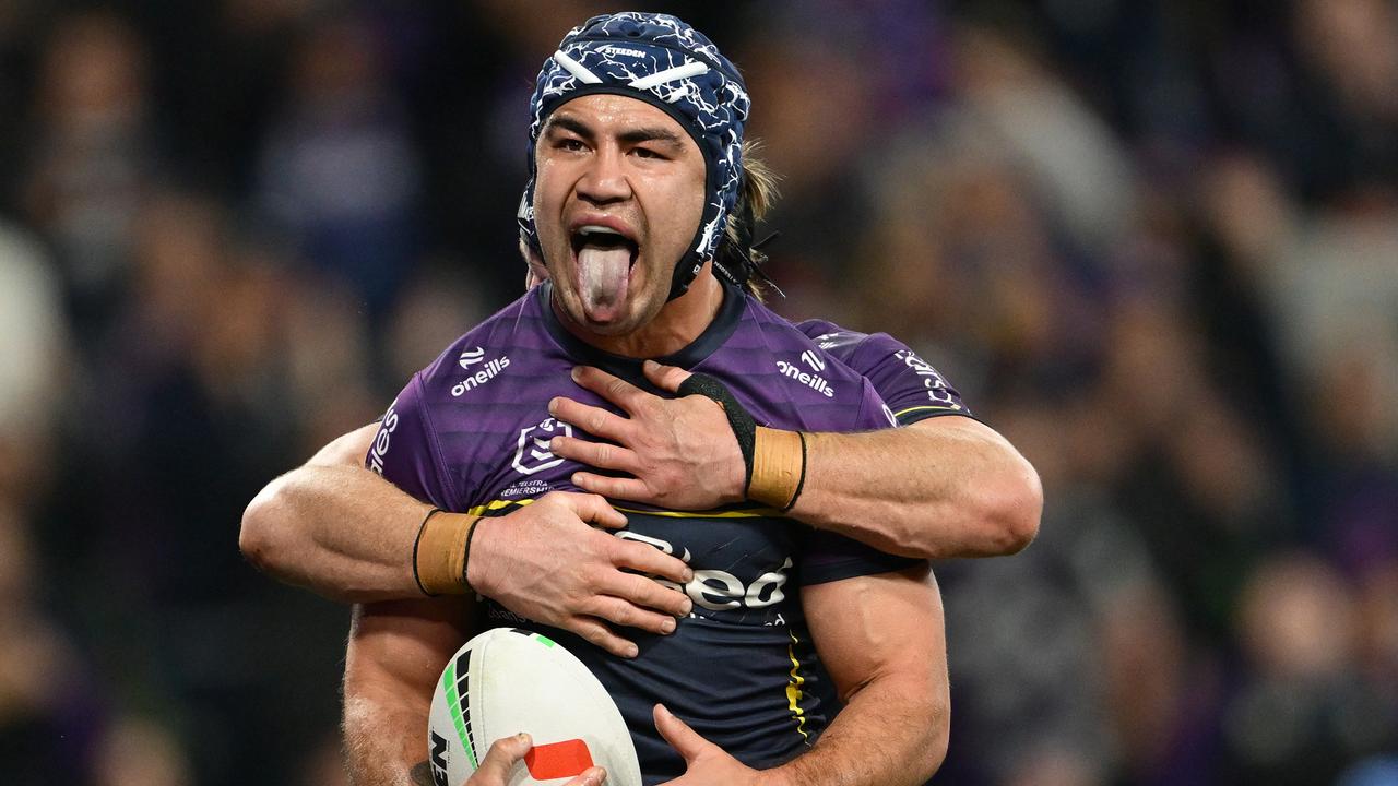 MELBOURNE, AUSTRALIA - SEPTEMBER 27: Jahrome Hughes of the Storm celebrates scoring a try during the NRL Preliminary Final match between the Melbourne Storm and Sydney Roosters at AAMI Park on September 27, 2024 in Melbourne, Australia. (Photo by Quinn Rooney/Getty Images)