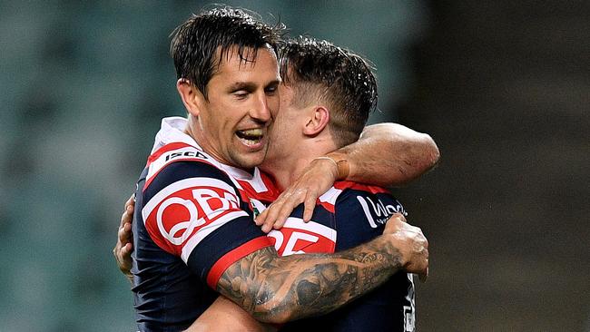 Mitchell Pearce hugs Connor Watson after a try.