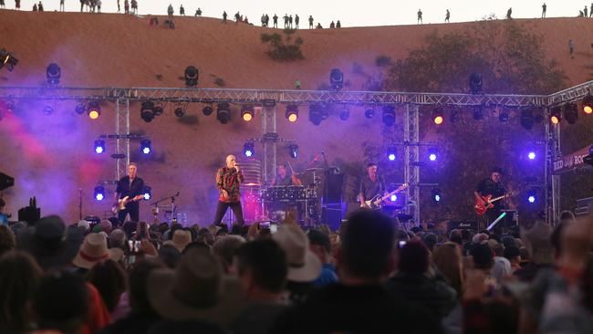 Midnight Oil at the Big Red Bash festival at the base of the Big Red sand dune west of Birdsville, Queensland. Picture: Lyndon Mechielsen