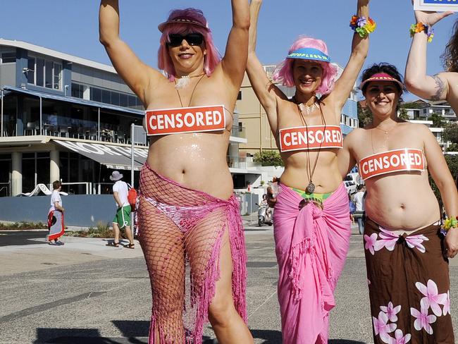 Raelian members protest at Bondi to fight for the right to be topless.