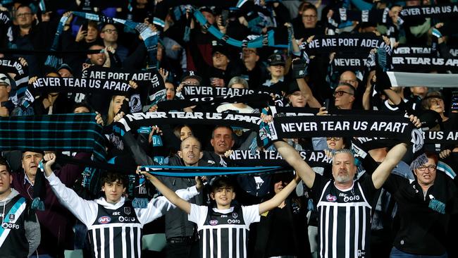 ADELAIDE, AUSTRALIA - OCTOBER 01: Power fans sing Never Tear Us Apart during the 2020 AFL First Qualifying Final match between the Port Adelaide Power and the Geelong Cats at Adelaide Oval on October 01, 2020 in Adelaide, Australia. (Photo by Michael Willson/AFL Photos via Getty Images)