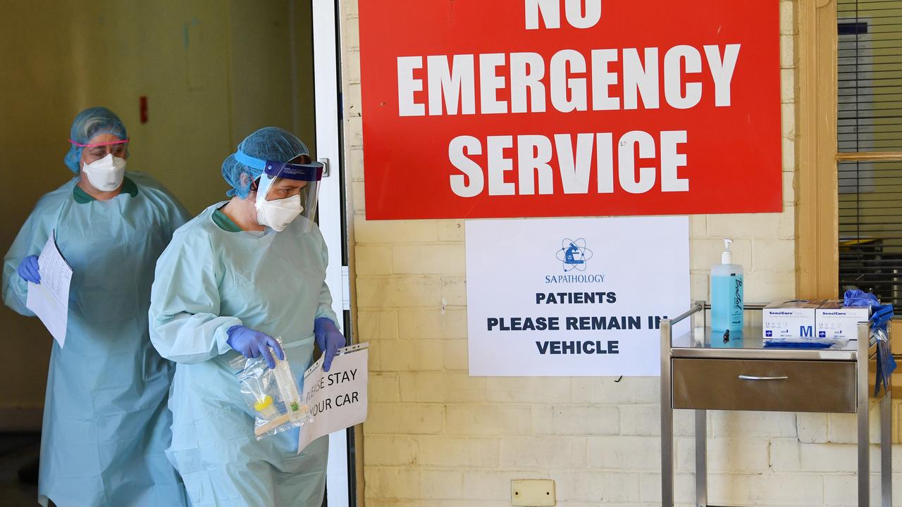 Hospital staff simulate a drive through coronavirus testing at the Repatriation Hospital in Adelaide on Tuesday. Picture: David Mariuz/AAP