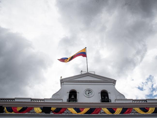 The Ecuadorian flag flies outside the Presidential Palace in Quito, Ecuador, on Monday, May 24, 2021. Guillermo Lasso takes office as Ecuador's president Monday promising to dig the nation out of its deepest economic slump in decades through mass vaccination and by making the country more investor-friendly. Photographer: Johis Alarcon/Bloomberg