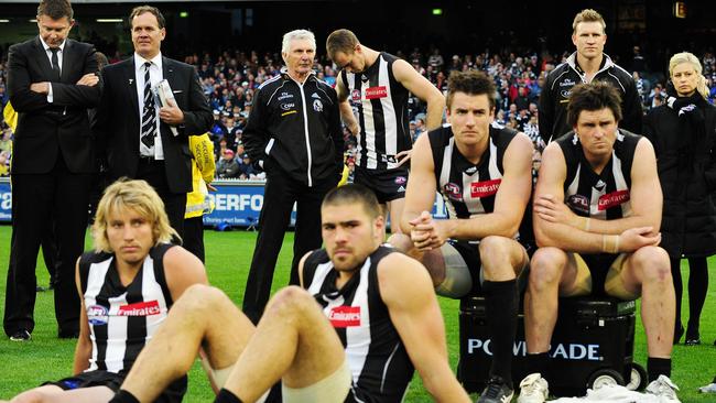 Gary Pert, Mick Malthouse and Nathan Buckley watch on after the 2011 Grand Final loss.