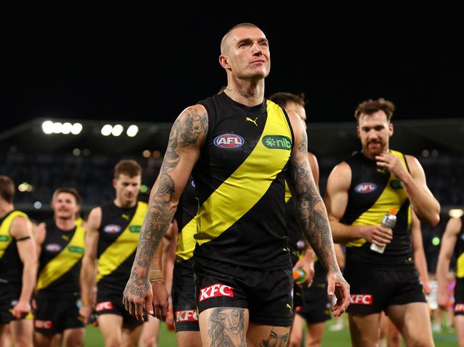 Fans flocking to the footy Saturday night can even get a haircut like their premiership hero. Picture: Getty Images