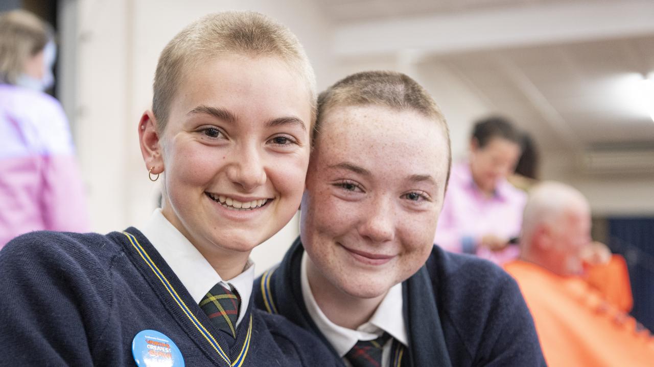 Olivine Murphy (left) and Lizzie Kelly after their shave as the Fairholme College community raise over $95k for the Leukaemia Foundation in the World's Greatest Shave, Friday, May 24, 2024. Picture: Kevin Farmer