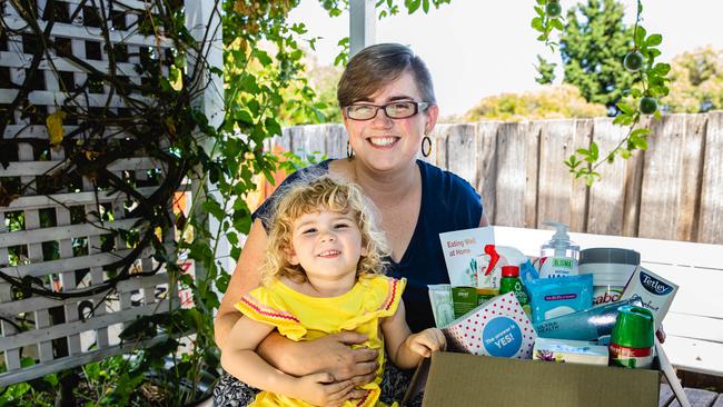 Jeddah Barwick from Dunalley Neighbourhood House and her daughter Arden (2) with some of the items that are to be distributed in care packs. Picture: Linda Higginson