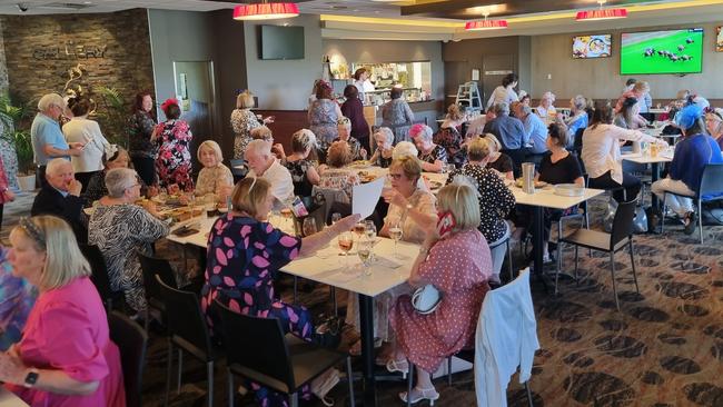 Ladies and gentlemen enjoying cup day at the Baulkham Hills Sports Club.