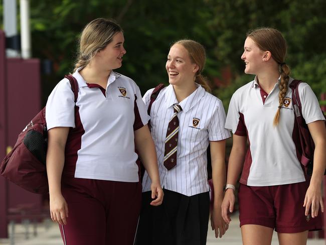 New Australian swimming star Ella Ramsay, back school at St Peters Lutheran College with school friends Victoria Kuhn 17, and Ella Kreutzer 16. Pics Adam Head