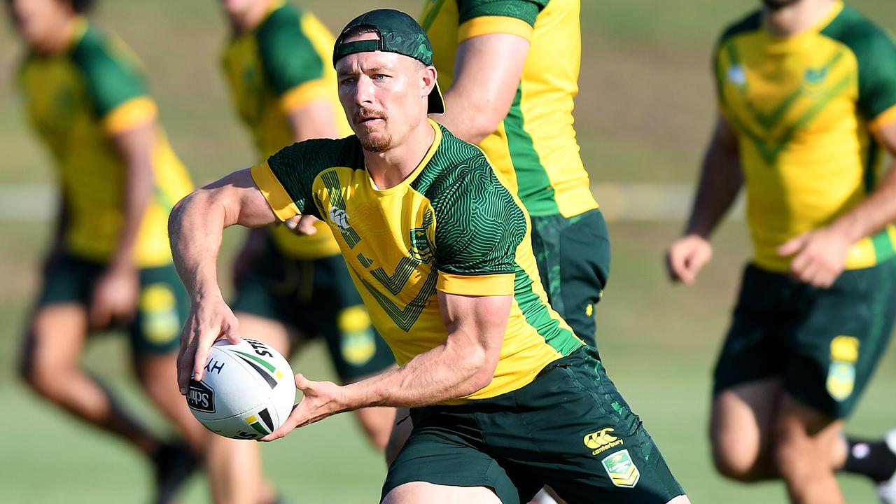 Damien Cook runs with the ball during an Australian Kangaroos training session. (Photo by Bradley Kanaris/Getty Images)