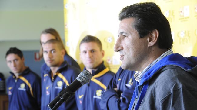 Socceroos Mark Millegan, Josh Kennedy, Patrick Kinsnorbo and Jason Culina watch as former captain Charlie Yankos speaks.