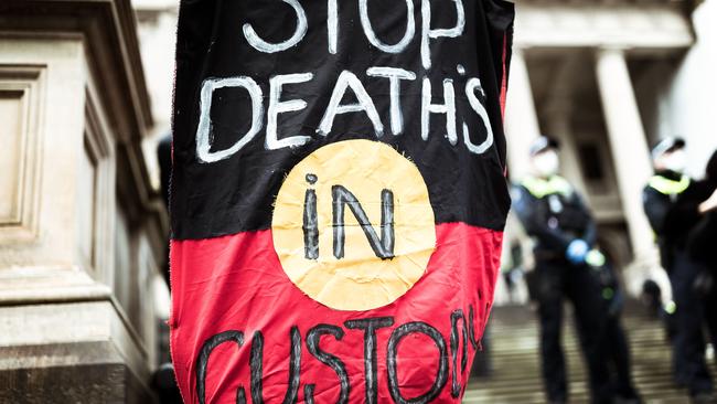 A sign at the Melbourne protest. Picture: Darrian Traynor/Getty Images