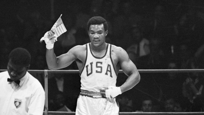 George Foreman waves the American flag after winning gold at the 1968 Olympics. Picture: Bettmann Archive/Getty Images/WSJ