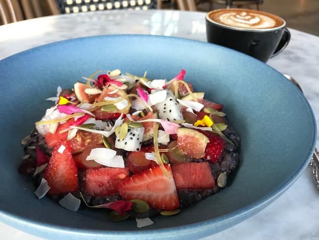 Black rice pudding with seasonal fruit and some of the best coffee around. Picture: Jenifer Jagielski