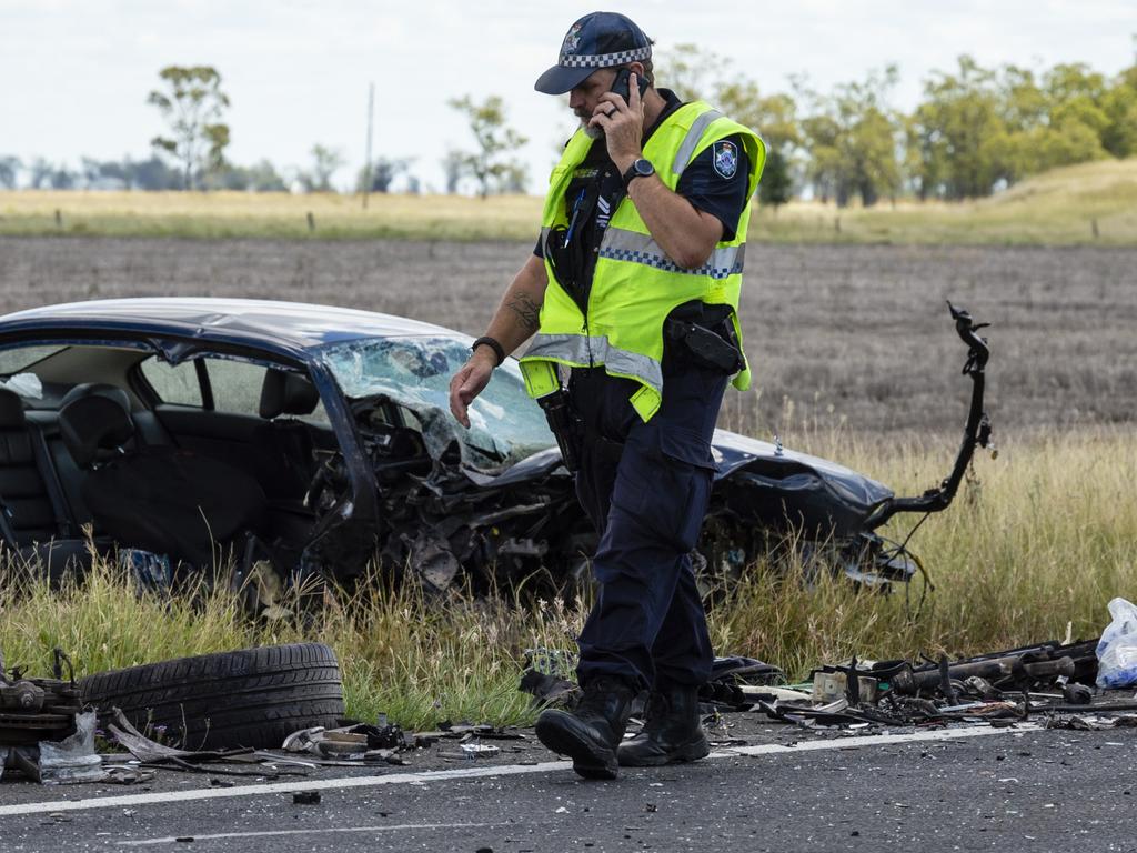 Emergency services at the scene of a fatal crash involving a truck and a car on the Warrego Hwy near Bowenville, Monday, February 7, 2022. Picture: Kevin Farmer