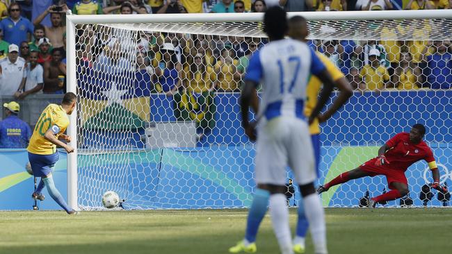 Neymar strokes the ball into the net from the penalty spot.